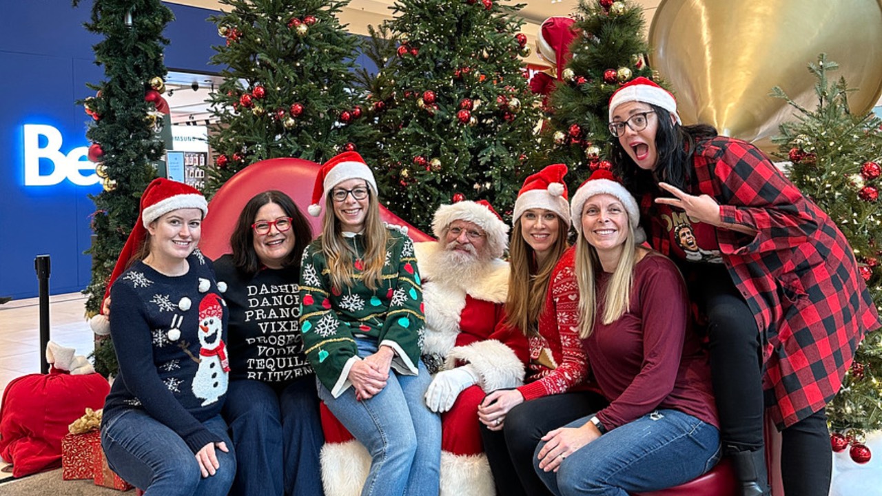 LeftTurn Strategy team meeting posing for a photo with Santa - how small businesses can give back